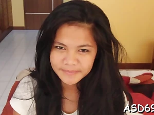 Asian gal spreads legs for a fuck